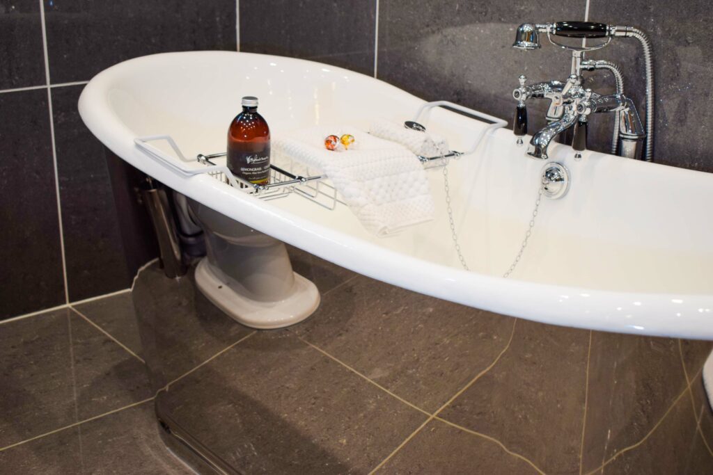 Out Outlander Hideaway Glencoe has a statement chrome free-standing two person bath.