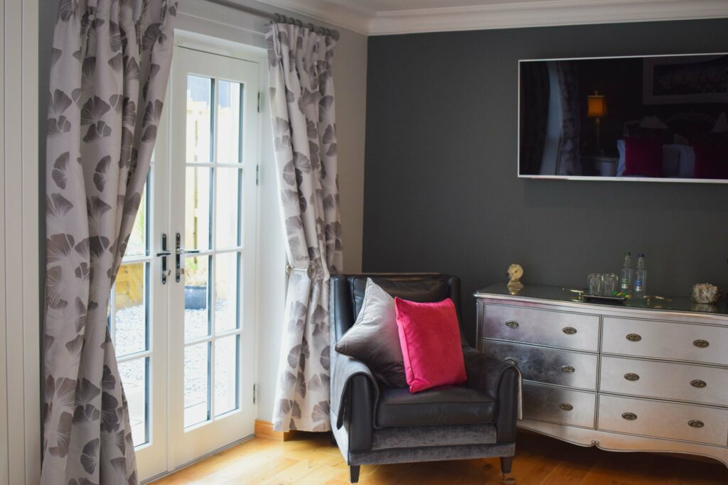 Our Outlander Luxury Hideaway has a private outdoor garden area accessed from French Windows in the bedroom