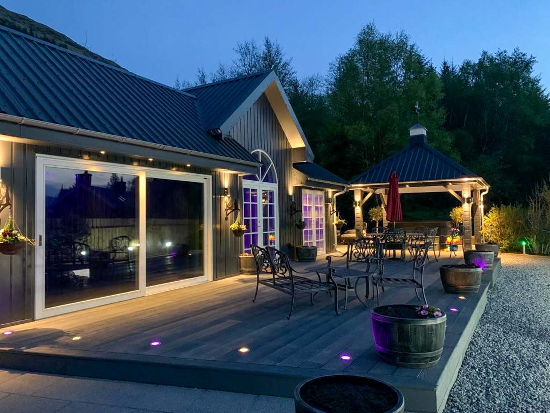 Little Fox Lodge Luxury Hideaway with its gorgeous decking, outdoor fireplace, sundeck and private hot tub.