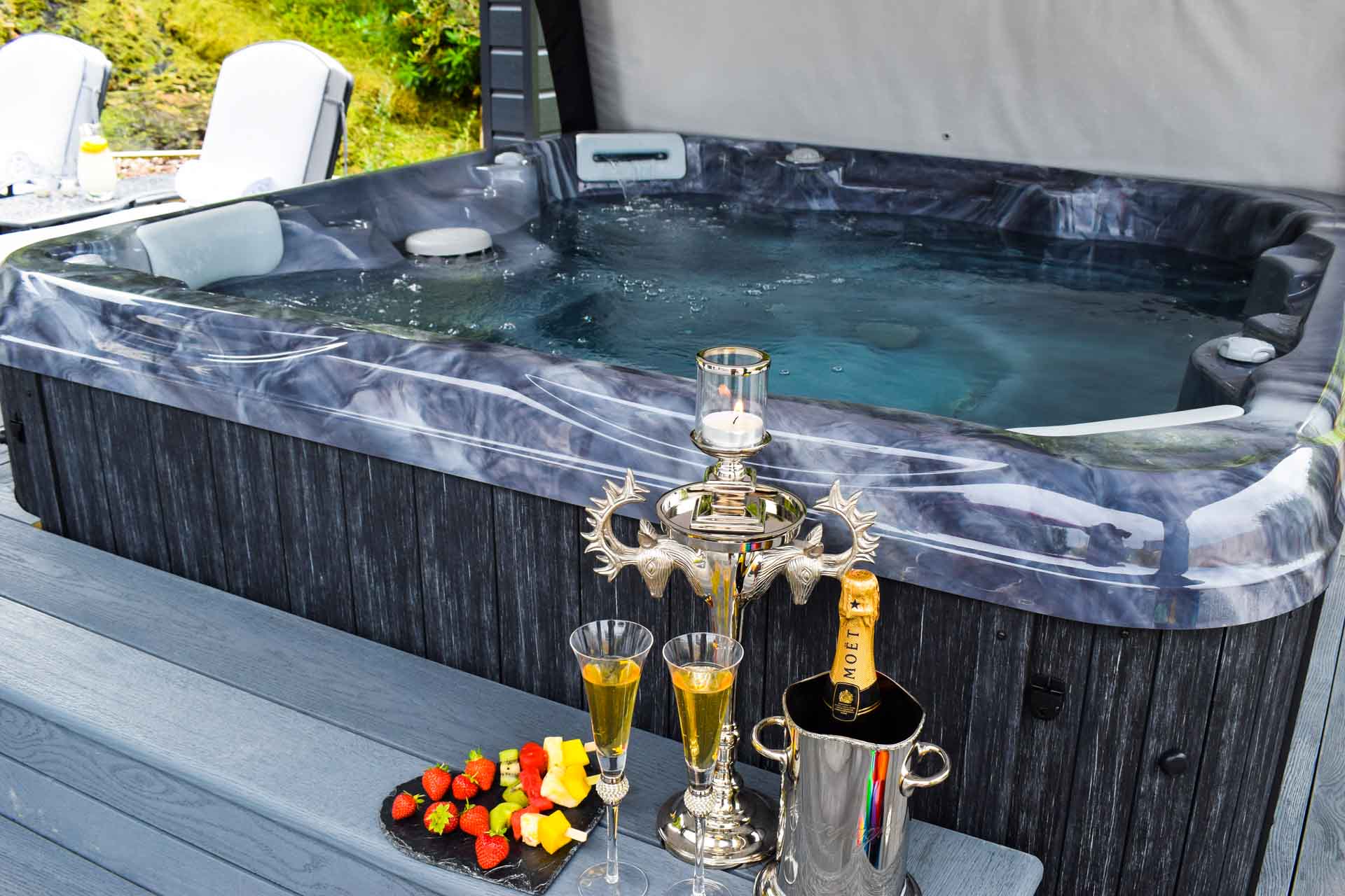 Relax in the hot tub at Little Fox Lodge Luxury Hideaway, near Glencoe